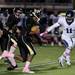 Pioneer senior linebacker Chad Reed moments before tackling Huron quarterback Josh Jackson on Friday. Pioneer won 35-6. Daniel Brenner I AnnArbor.com